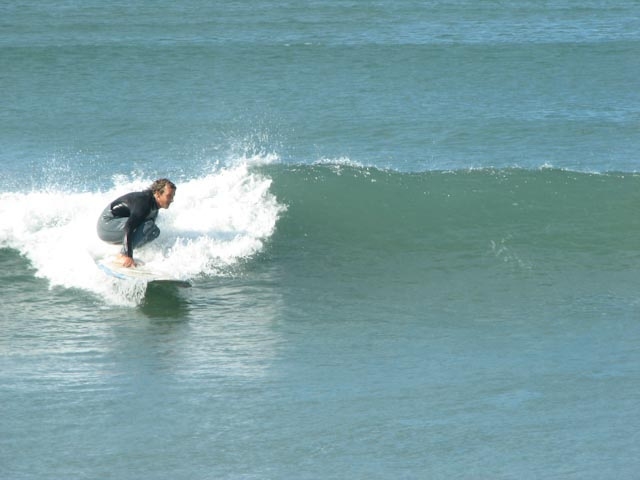Image Captioning: surfer in the sea example